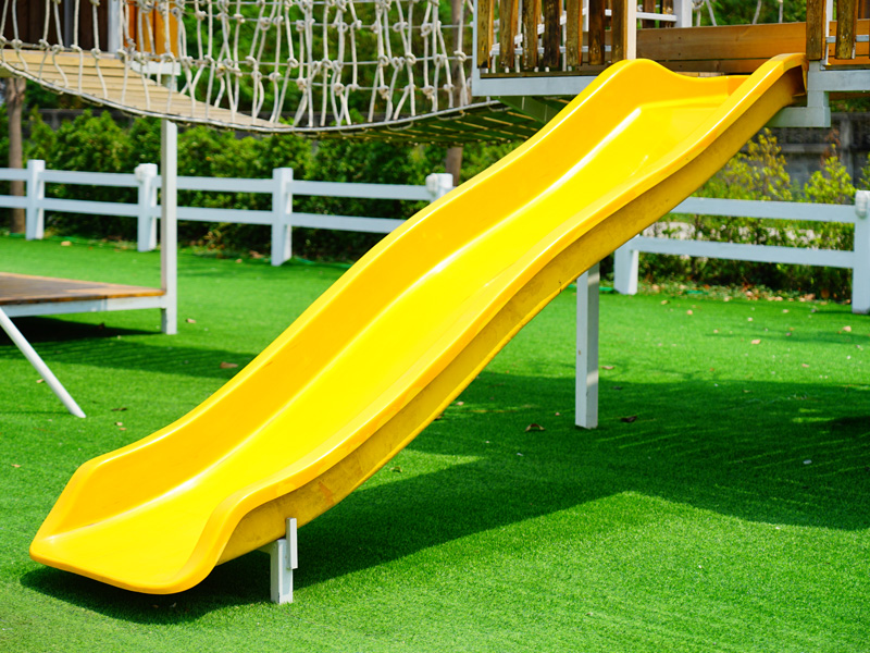 kids slide on turf grass