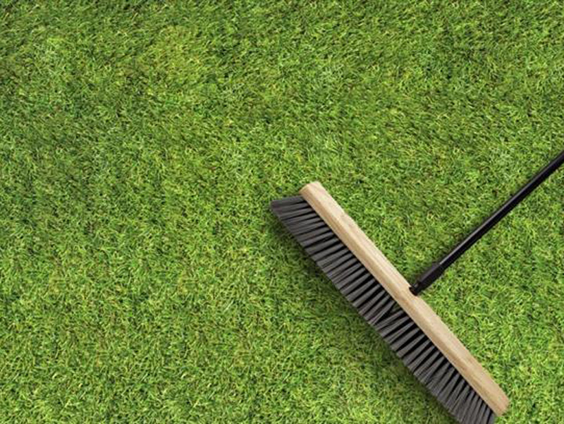 long broom on turf