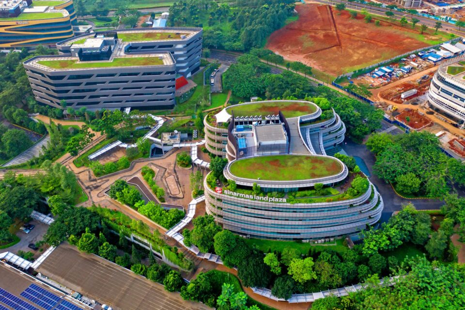 Aerial view of office buildings with landscaped green space, evoking the Energy Corridor in west Houston, TX