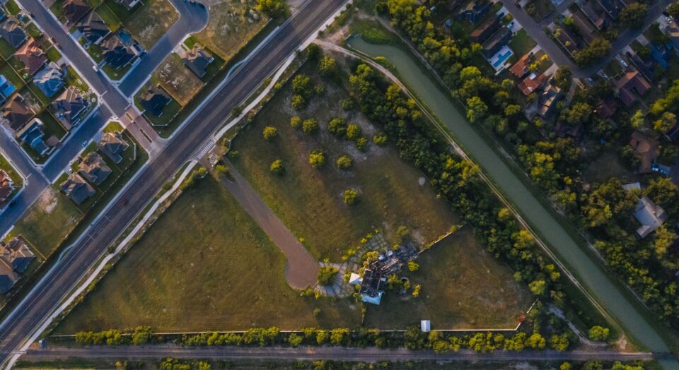 Aerial view of a suburban neighborhood and green open space, typical of Jersey Village, TX