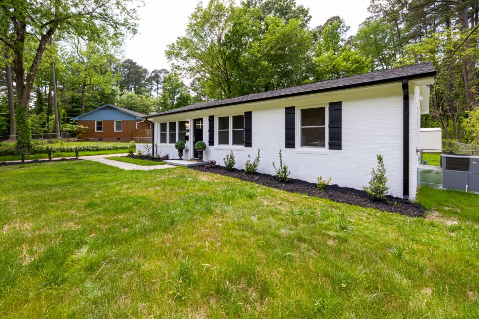 A suburban home with a lush green lawn and landscaping, typical of the Louetta corridor in northwest Harris County, TX