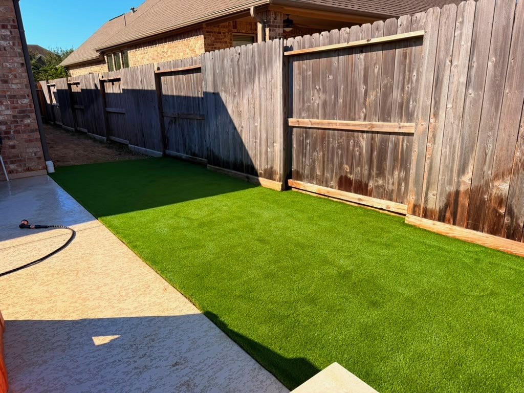 Artificial turf side yard next to a patio in Tomball, TX